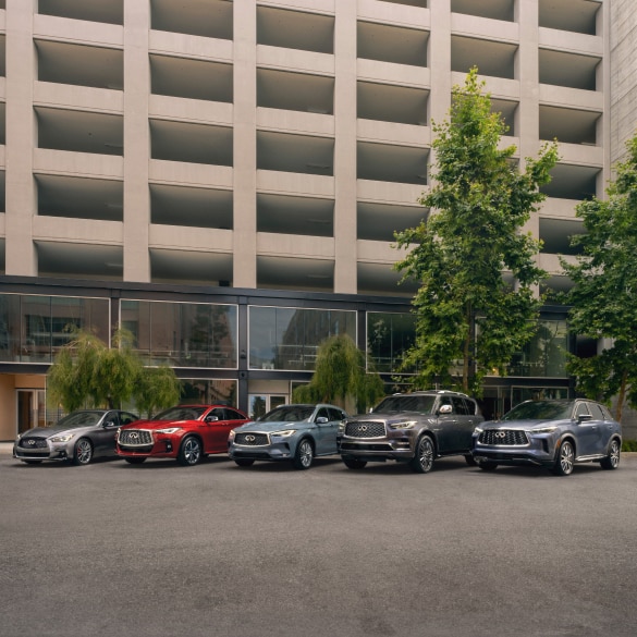 Pack shot of the full INFINITI luxury vehicle lineup parked highlighting the front of all models