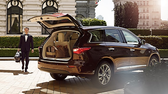 Rear exterior profile of 2013 INFINITI JX35 with liftgate open and highlighting cargo space