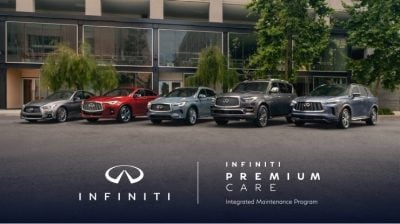 Driver sitting in an INFINITI vehicle, looking satisfied with INFINITI Premium Care services