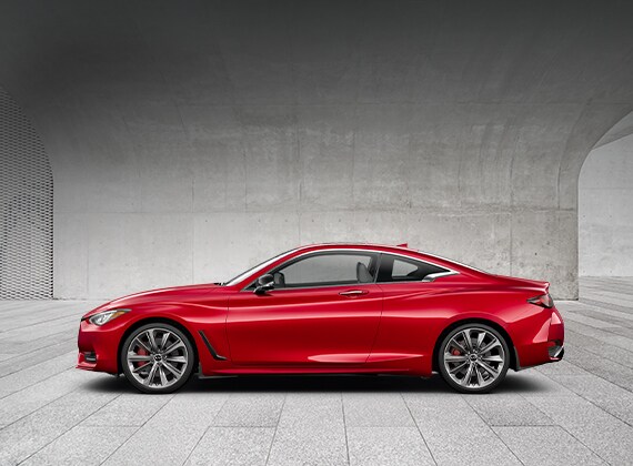 Driver side profile of a red INFINITI Q60 Coupe