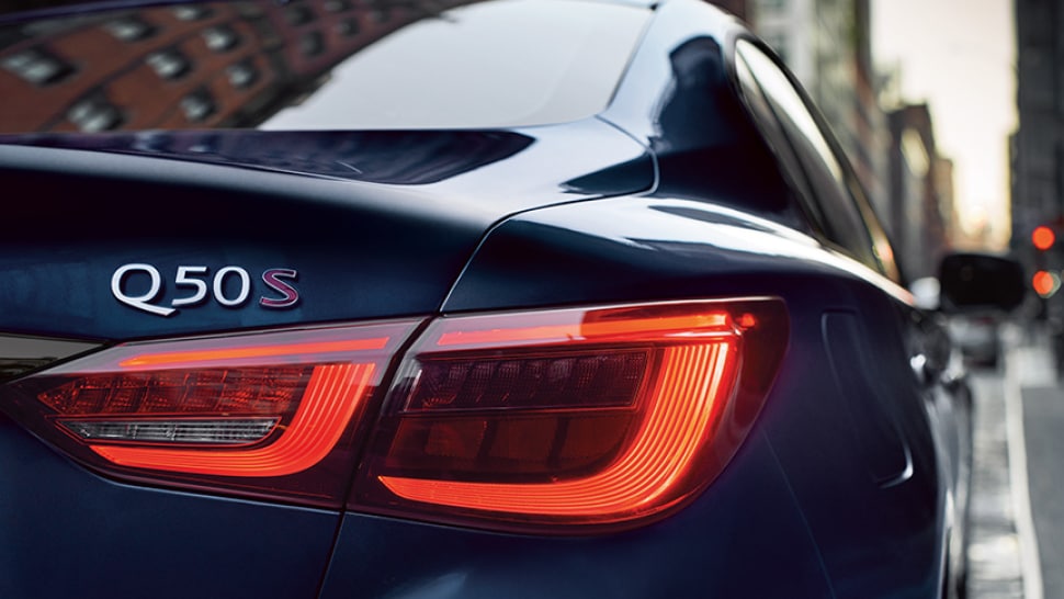 Rear profile view of a blue 2024 INFINITI Q50 RED SPORT 400