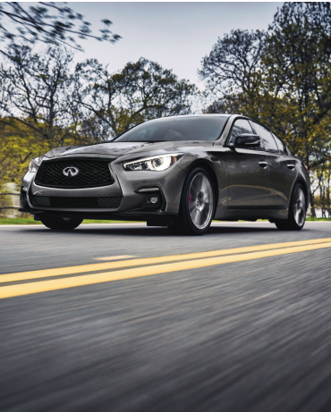Driver side profile view of a gray 2024 INFINITI Q50 RED SPORT 400