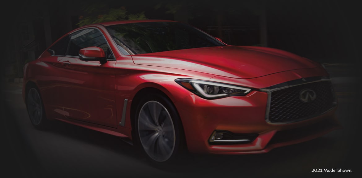 Passenger side profile view of a red 2022 INFINITI Q60 Coupe