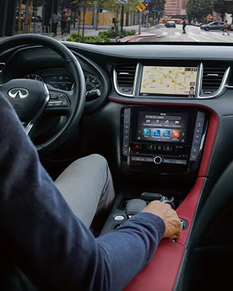 2023 INFINITI QX55 interior highlighting steering wheel & INFINITI InTouch connectivity