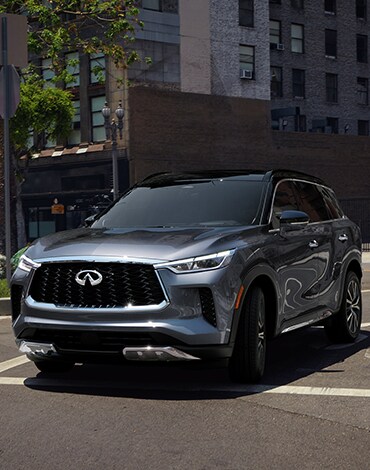 Exterior front profile view of 2022 INFINITI QX60 shown in Moonbow Blue color