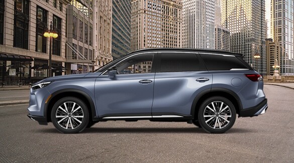 Side profile of 2022 INFINITI QX60 Crossover SUV in Moonbow Blue color