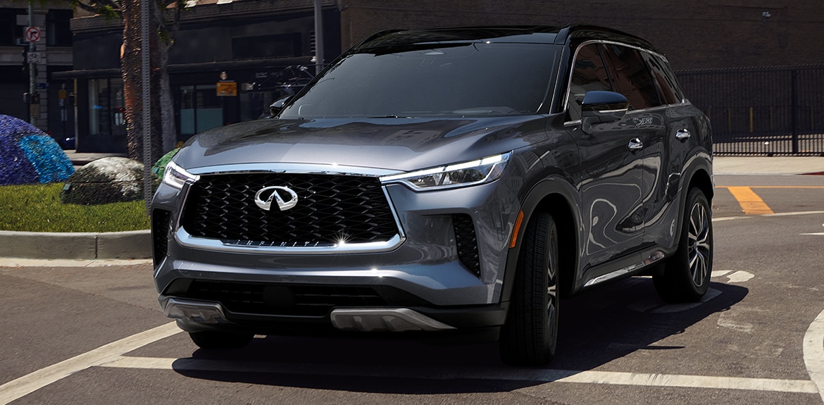 Rear exterior view of 2023 INFINITI QX60 Crossover SUV highlighting LED taillights