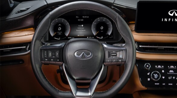 Close up of 2023 INFINITI QX60 interior highlighting QX60's steering wheel