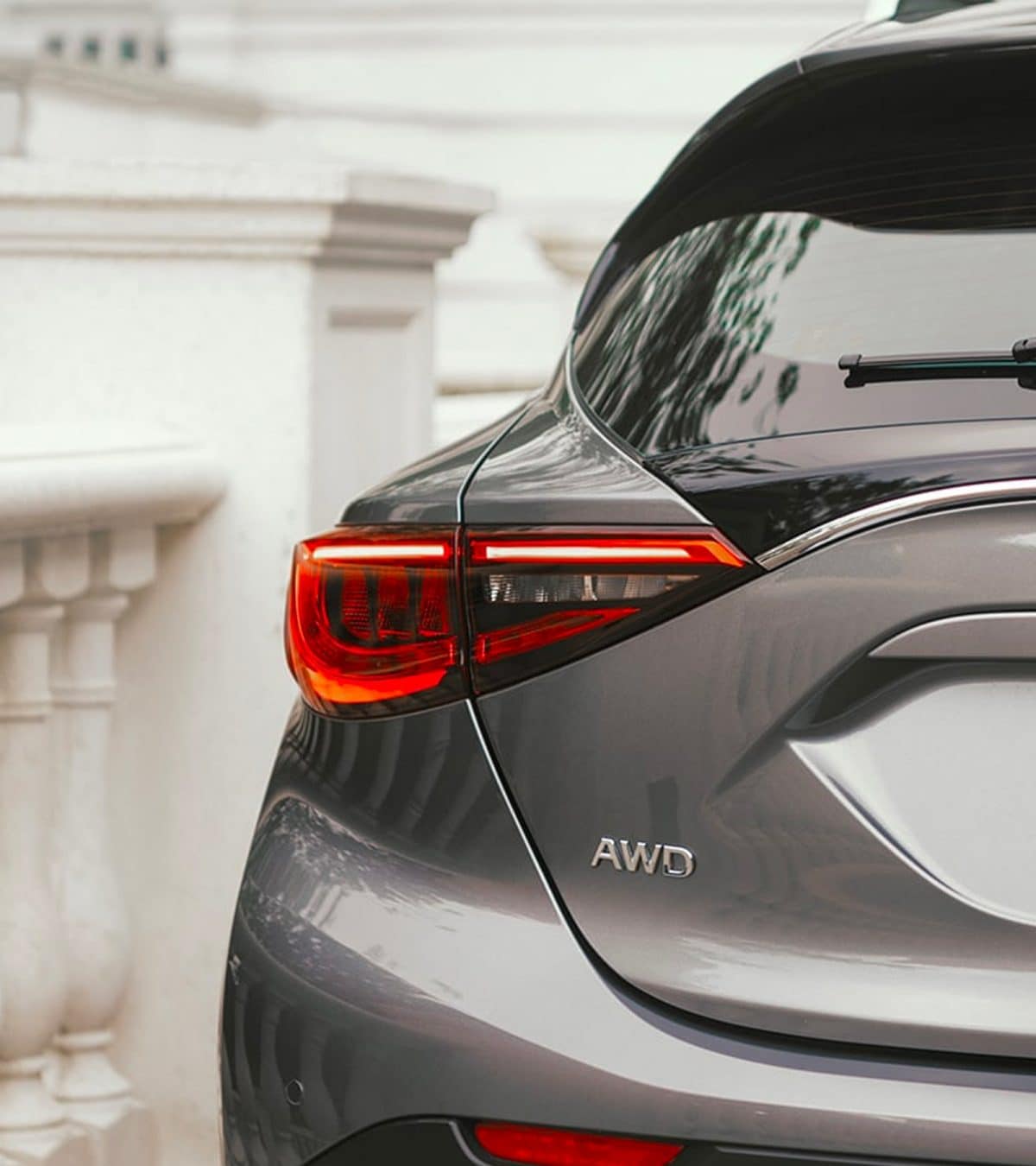 Rear Close Up View Of 2019 INFINITI QX30 Exterior Badge Highlighting LED Tail Lights