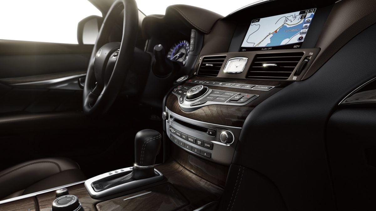 Interior View Of The 2019 INFINITI Q70L Luxury Sedan Highlighting INFINITI InTouch Navigation Technology and Driver Console
